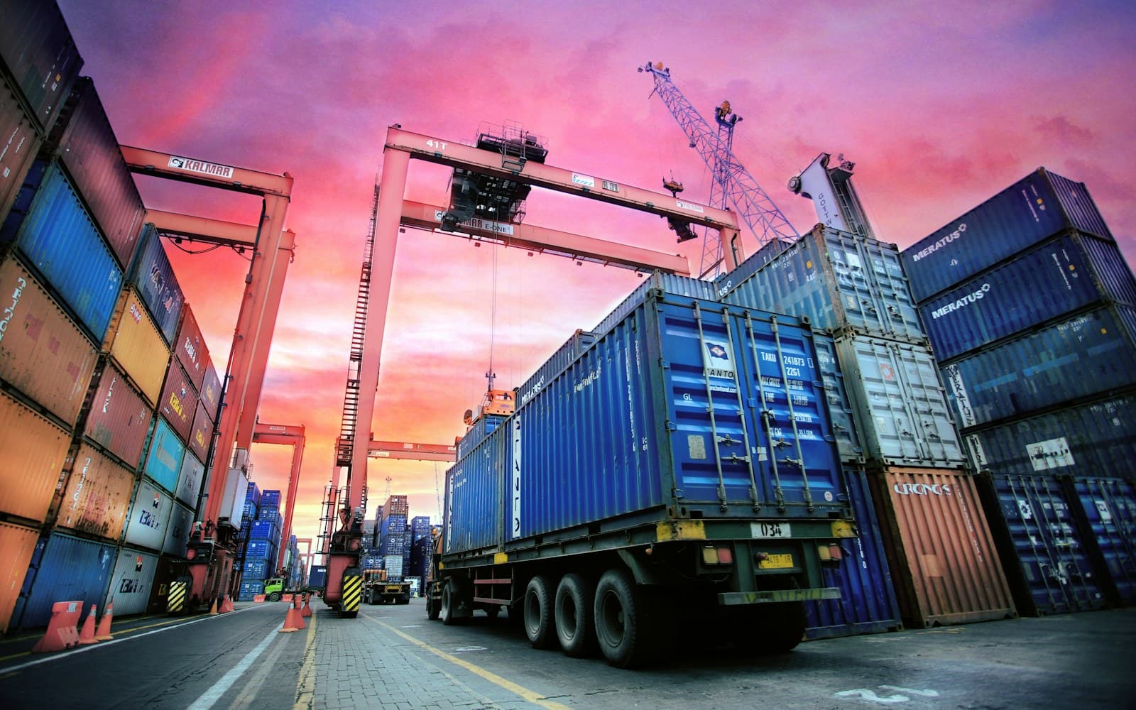 Telehandler moving palletised freight in a KEZAD logistics warehouse